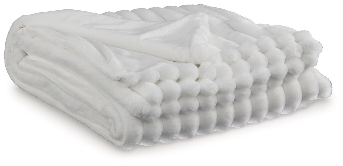 Soft woven Alsonwell throw blanket by Unique Piece Furniture, draped over a chair with cozy, textured fabric in neutral tones.