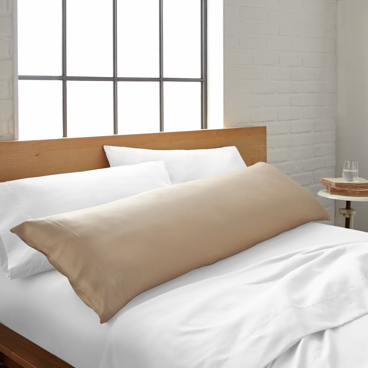 Taupe bamboo body pillowcase from Bamboo is Better, shown on bed, featuring smooth, cooling bamboo fabric for comfortable sleep.