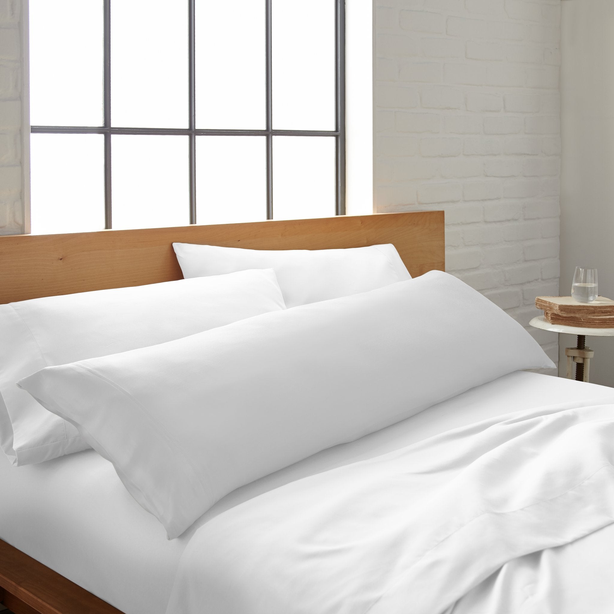 White bamboo body pillowcase from Bamboo is Better, designed for cooling and comfort on a bed.