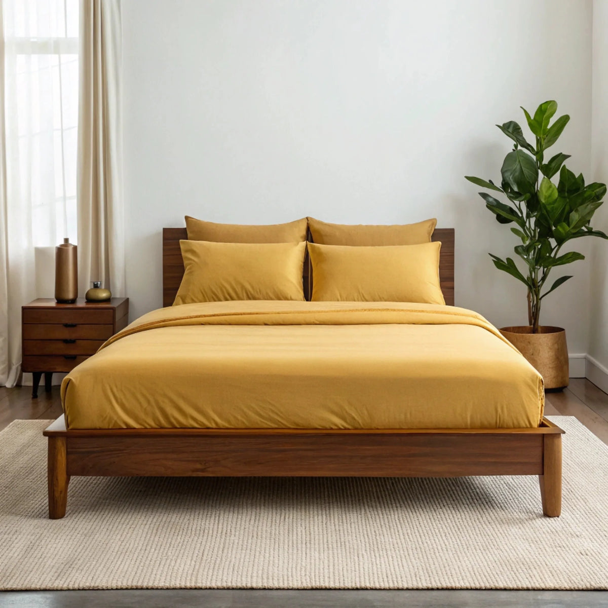 Copper infused bamboo sheet set by Bamboo is Better, mustard color, full size, shown on a bed in a cozy walnut bedroom setting.