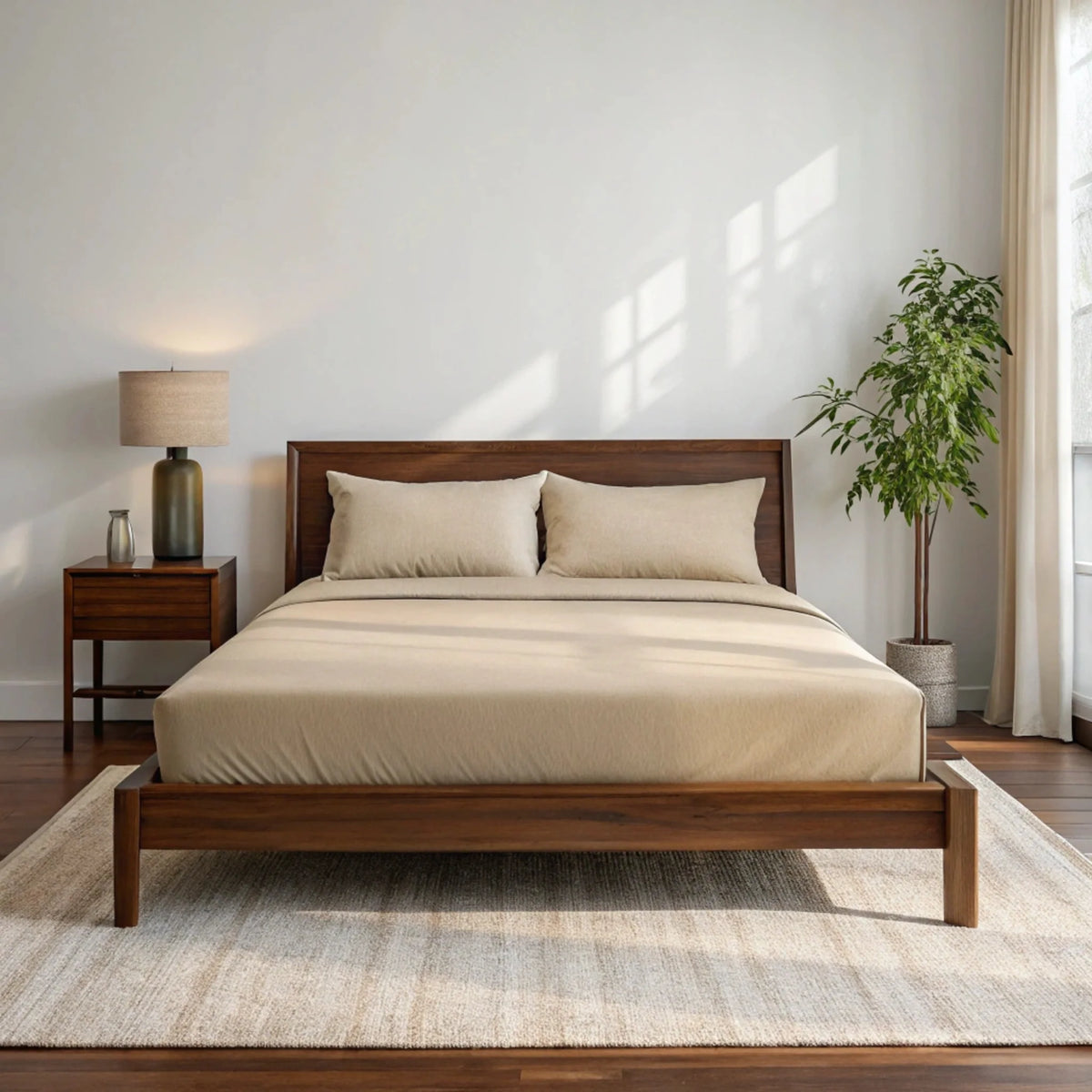 Copper-infused bamboo sheet set by Bamboo is Better, shown in a cozy bedroom with full bed, cooling, soft bamboo sheets in a walnut-toned room.
