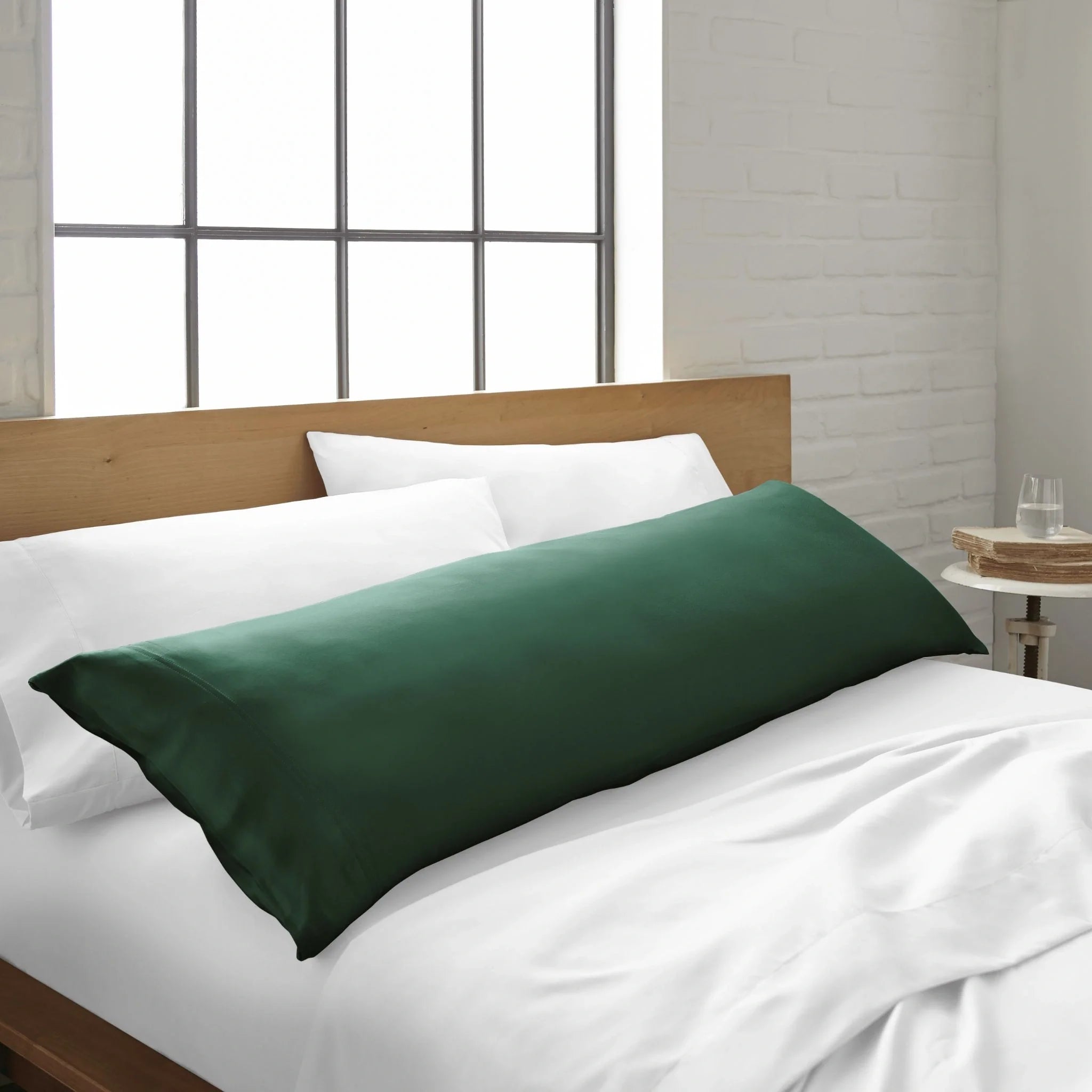 Emerald-green bamboo body pillowcase from Bamboo is Better, designed for cooling and comfort on a bed.
